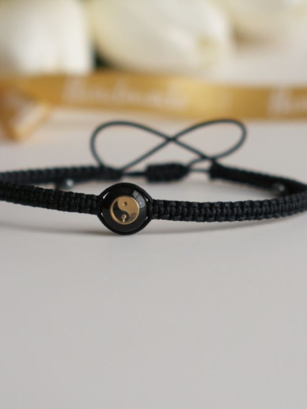 Black Woven Bracelet with Gold Yin Yang Charm